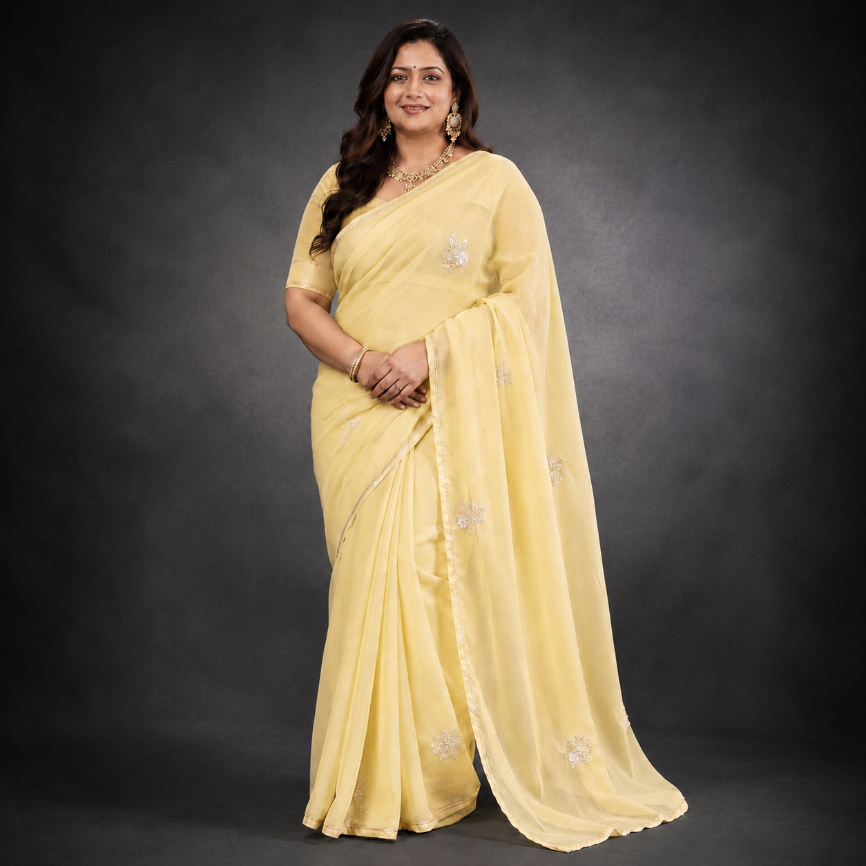 Archana: Yellow Chiffon saree with sequins