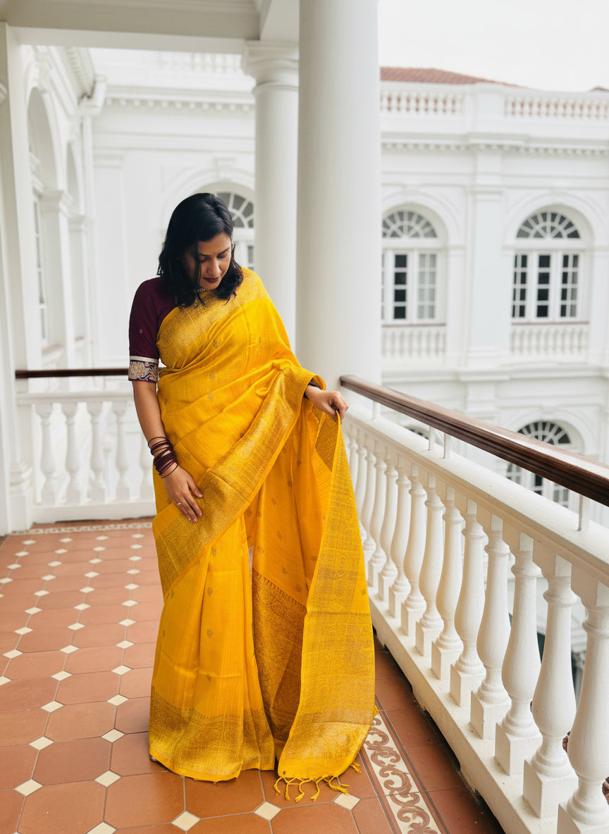 Sunehra: Yellow Handwoven Silk Saree with Pink Contrast Blouse.